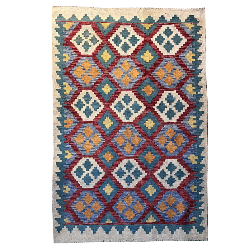 Handwoven flat-weave Kilim rug with rows of diamond medallions