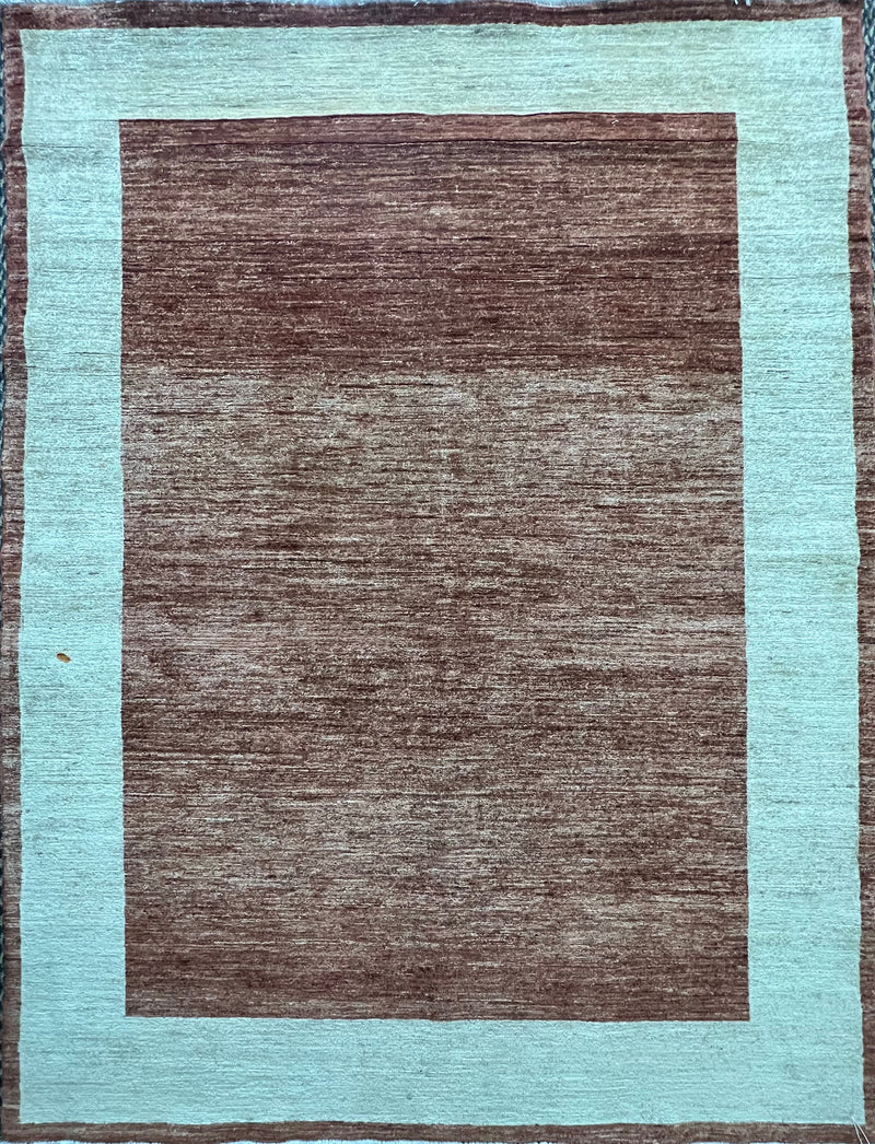 Hand-knotted Gabbeh rug with a brown abrash field and turquoise border