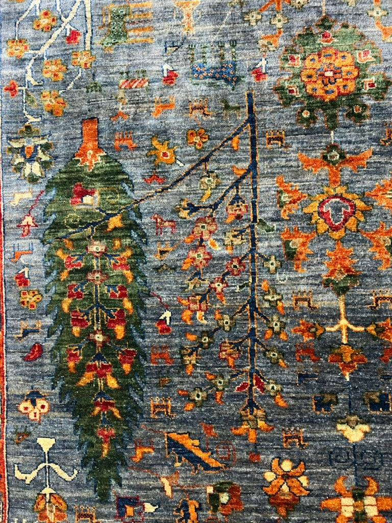 Khurjin Rug — Tree of Life (Sky Blue/Multi) Hand-Knotted Wool – 9′8″ × 6′7″ | Afghan Craftsmanship · Afghan Khurjin Tree of Life rug hand-knotted wool tribal pattern detail artisan craftsmanship premium area rug

