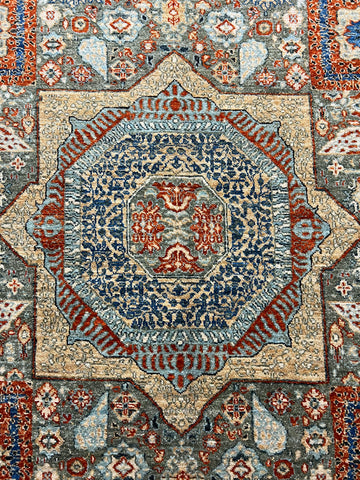 Afghan Mamluk rug hand-knotted wool detail closeup artisan Oriental craftsmanship

