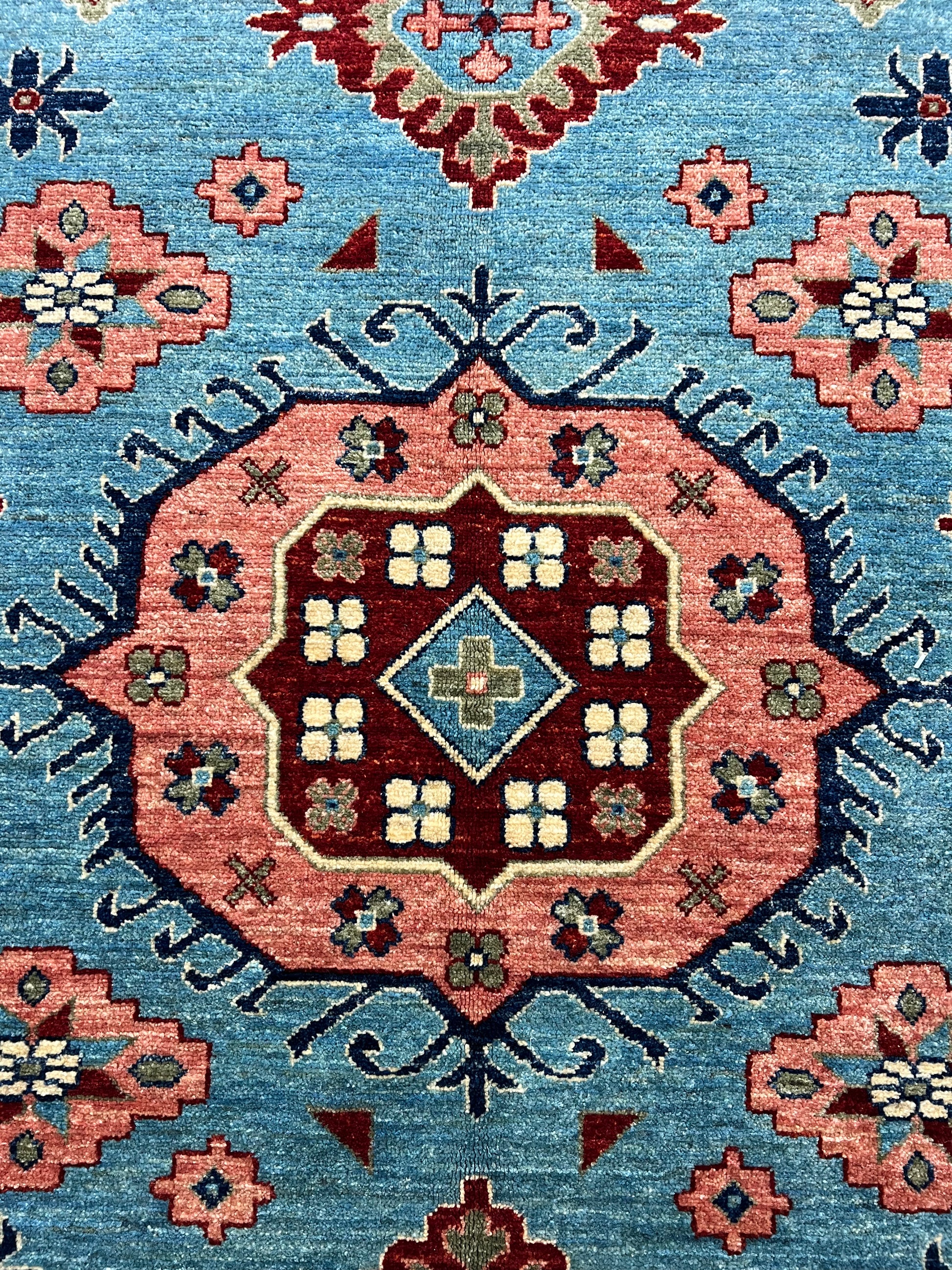 Afghan Oriental Mamluk rug hand-knotted wool closeup artisan texture detail

