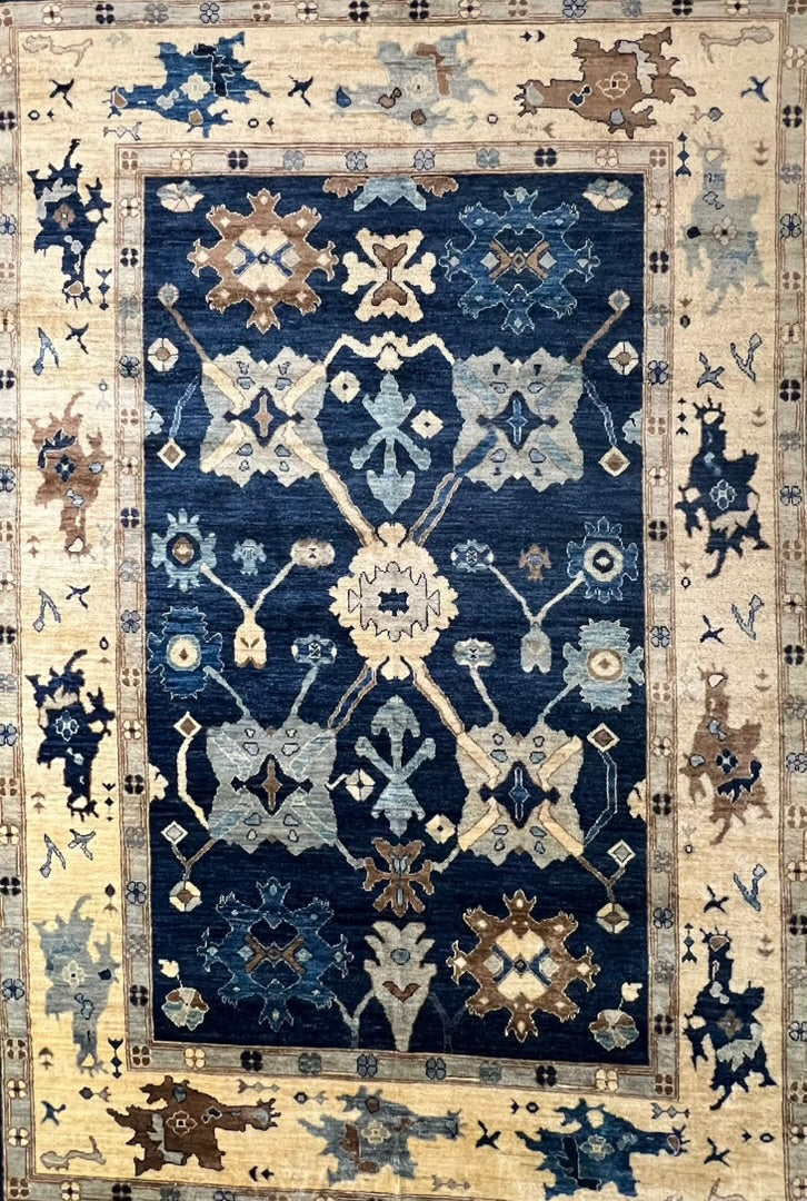 Afghan Oushak Ghazni wool rug hand-knotted detail artisan craftsmanship closeup


