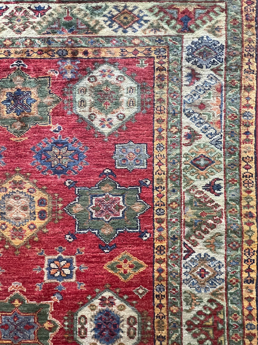 Afghan Super Kazak hand-knotted rug wool tribal detail artisan craftsmanship closeup

