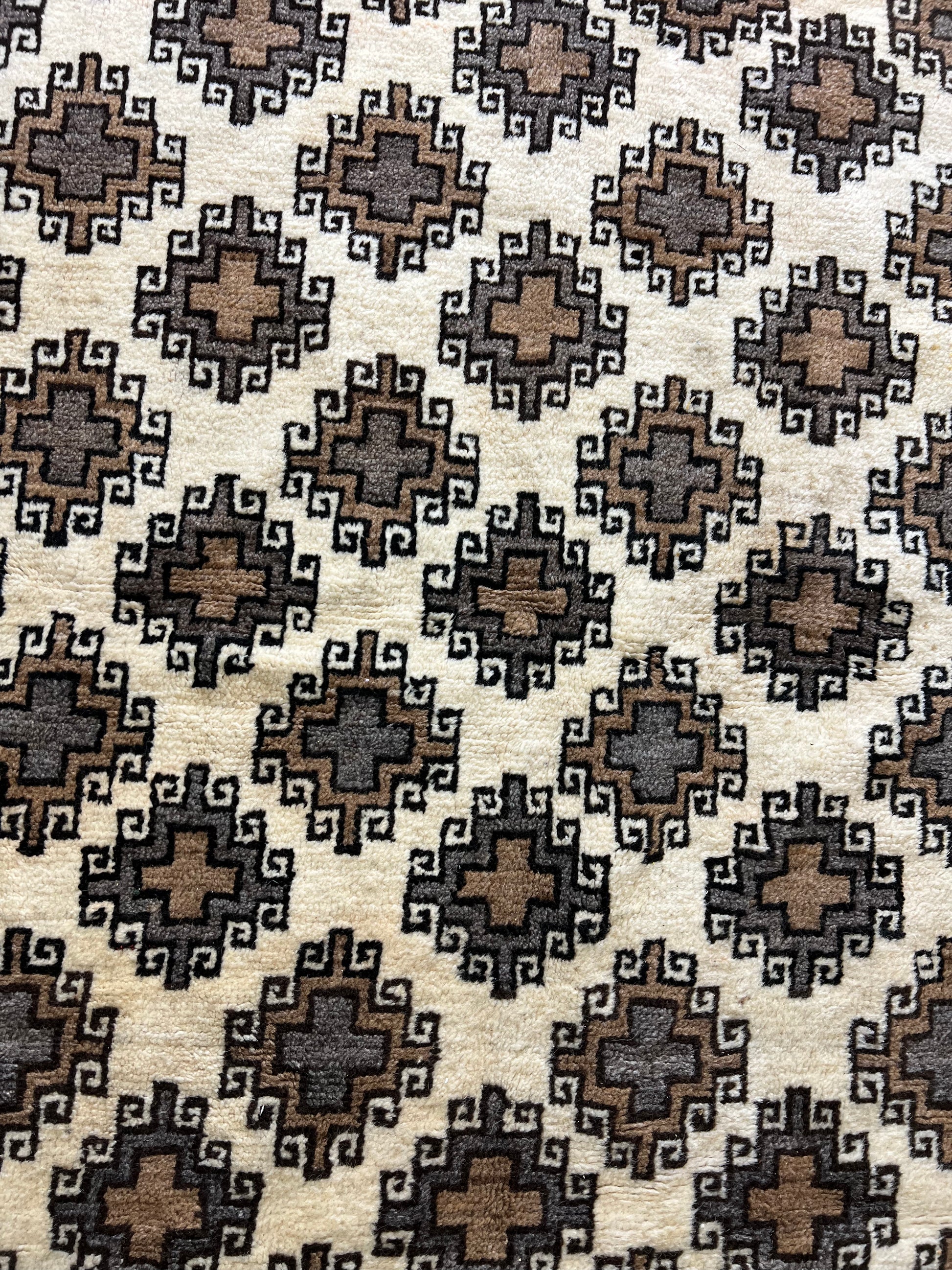 Antique Oriental rug close-up soft plush wool texture hand-knotted craftsmanship detail