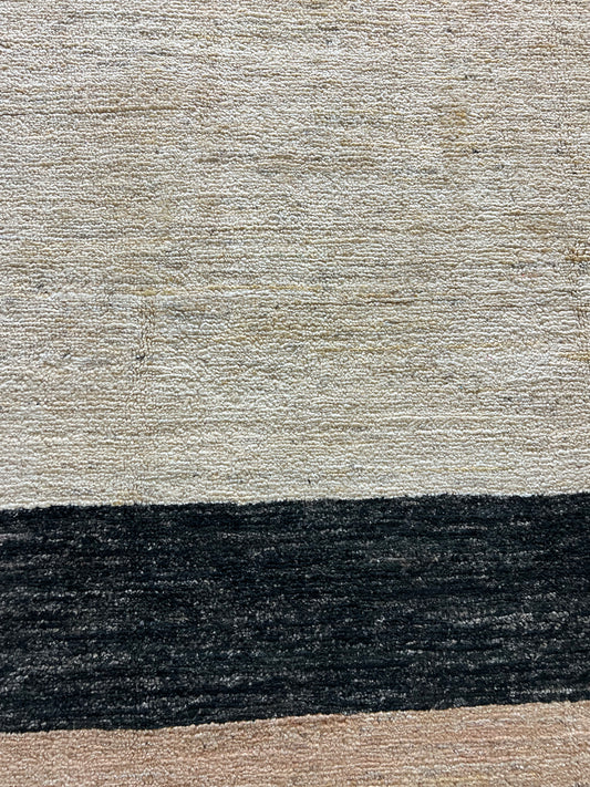 Contemporary wool rug close-up artisan craftsmanship handwoven texture detail

