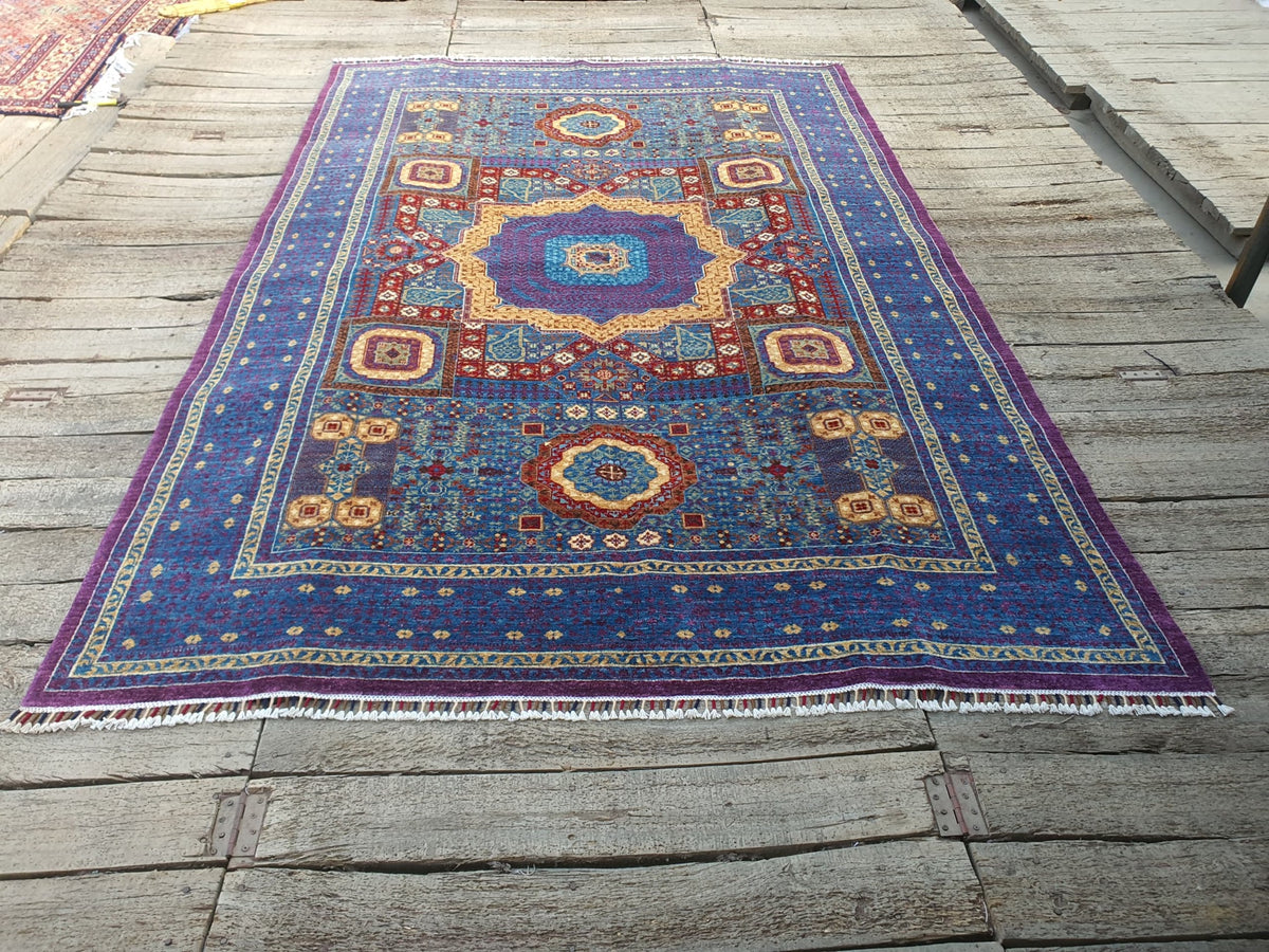 A finished hand-knotted Mamluk rug in blue and violet