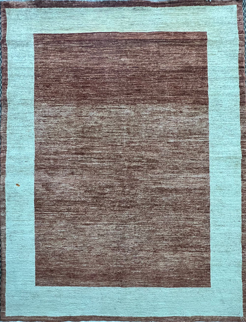 Close-up of the wool weave and pattern detail on the Gabbeh rug.
