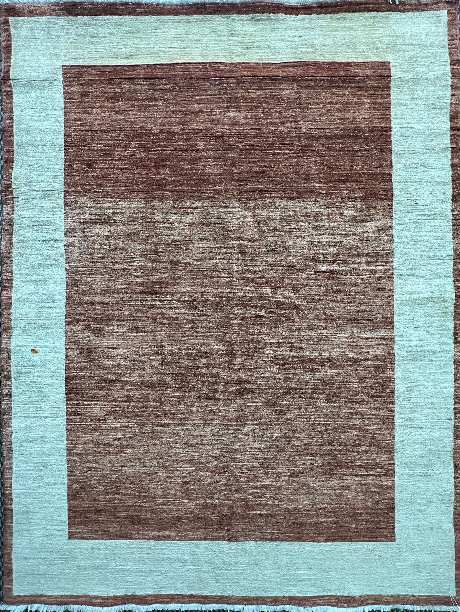 8.1′ × 6.4′ Gabbeh Rug – Hand-Knotted Wool | Persian-Inspired Artisan Craftsmanship | Luxury Tribal Contemporary Area Rug · Gabbeh wool rug shown at an angle to reveal colour and design.