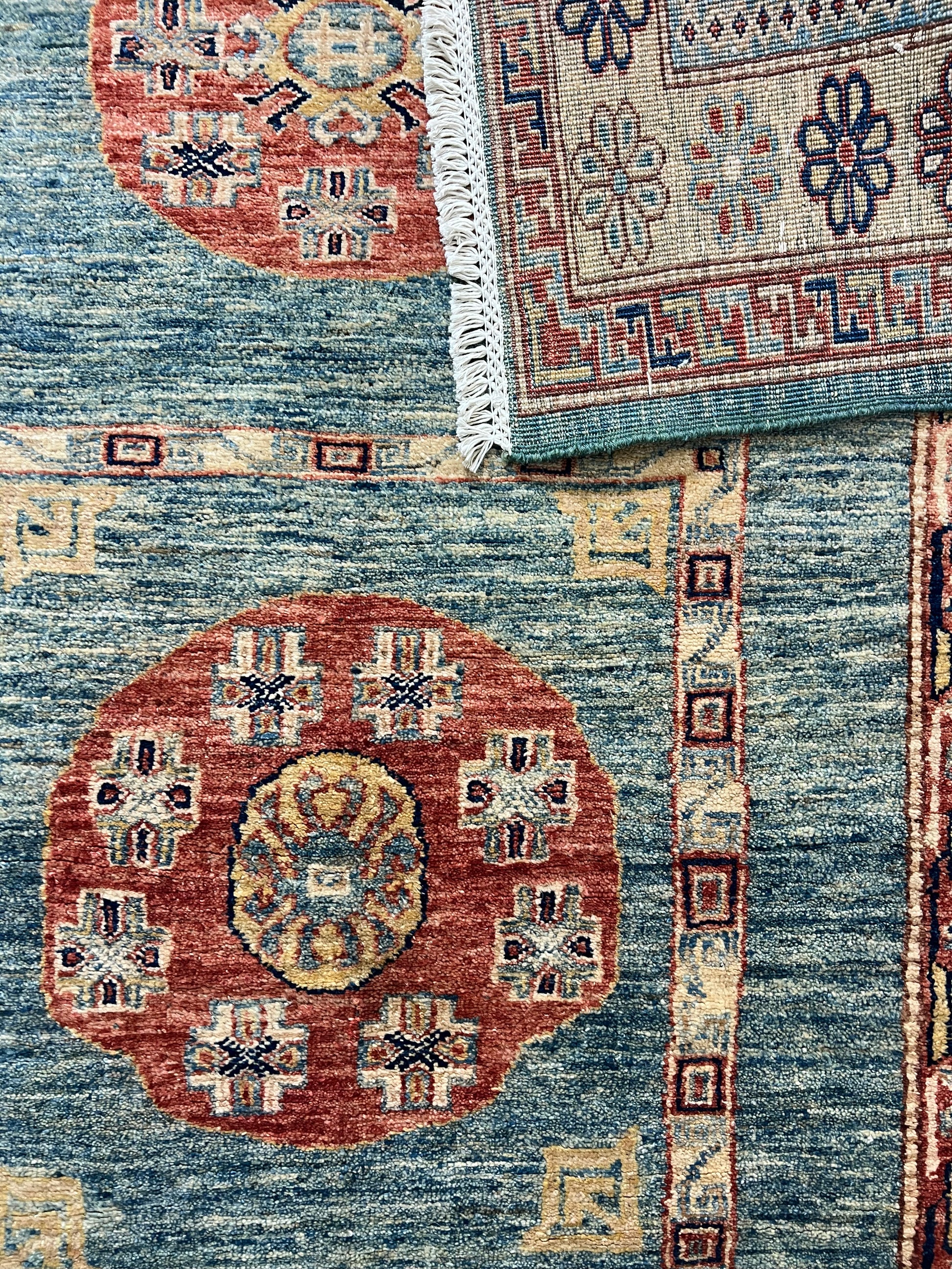 Gabbeh rug close-up wool texture tribal pattern hand-knotted artisan craftsmanship detail
