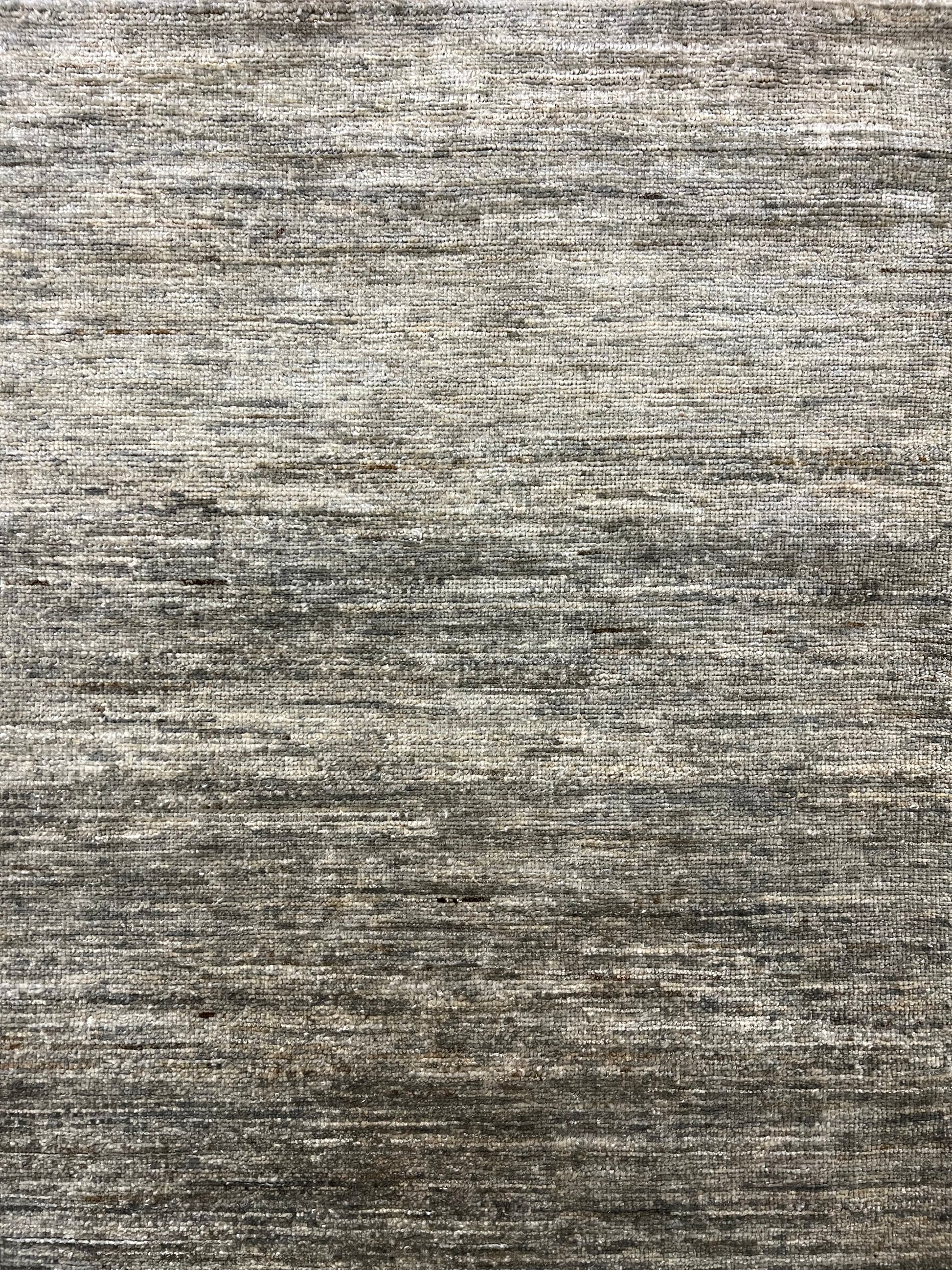 Gabbeh square rug close-up detail hand-knotted wool texture artisan craftsmanship