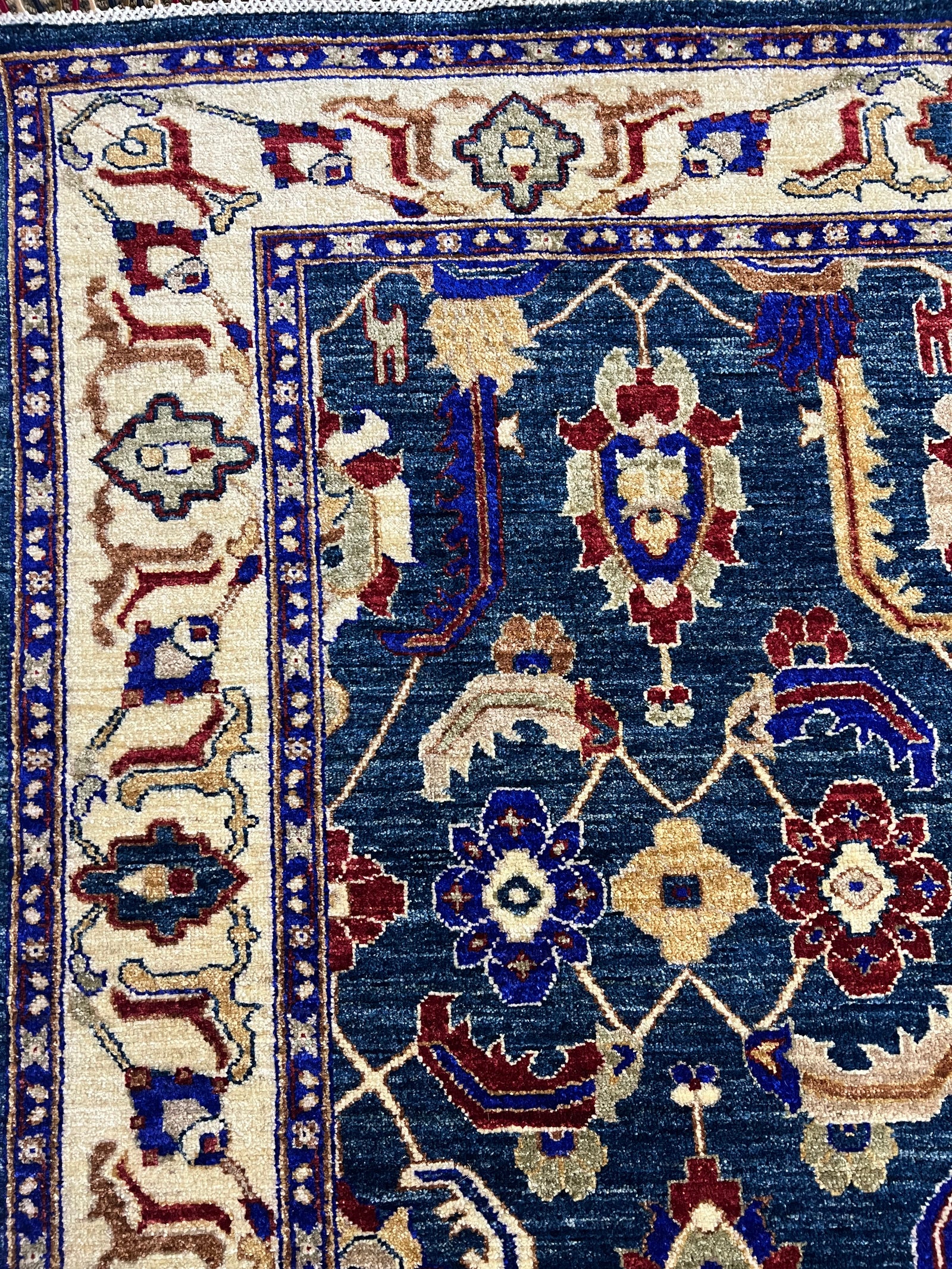 Oushak Luxury Hand-Knotted Wool Rug – 6′6″ × 5′2″ | Afghan Craftsmanship · Close-up of hand-knotted Oushak wool rug showing low pile texture and artisan craftsmanship
