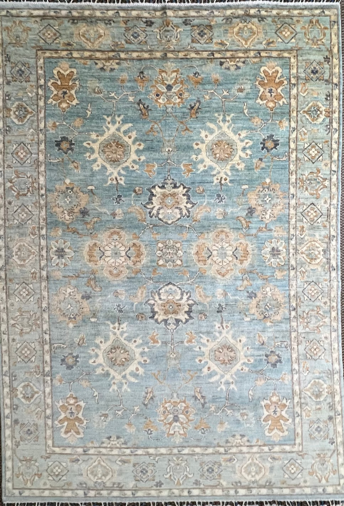 Luxury rug with floral patterns on a light blue background